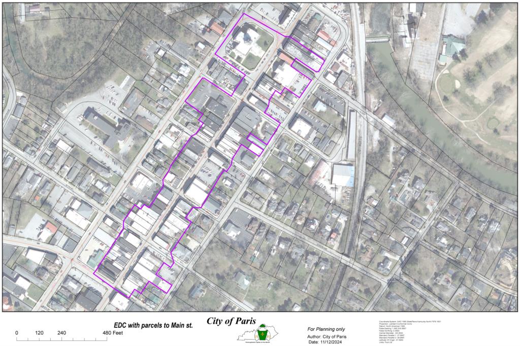 Aerial map of downtown Paris with the Entertainment District boundary outlined in purple along Main Street and around Courthouse Square. Opens the map PDF.