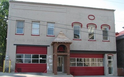 Paris fire station with a fire engine parked in an open bay.