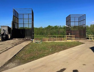 Tall caged loading structures at the former transfer station.