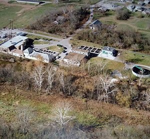 Aerial view of the water treatment plant buildings and basins.