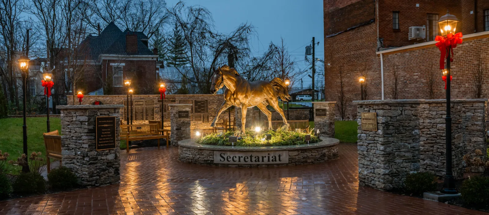 Secretariat statue lit at dusk in Secretariat Park, downtown Paris